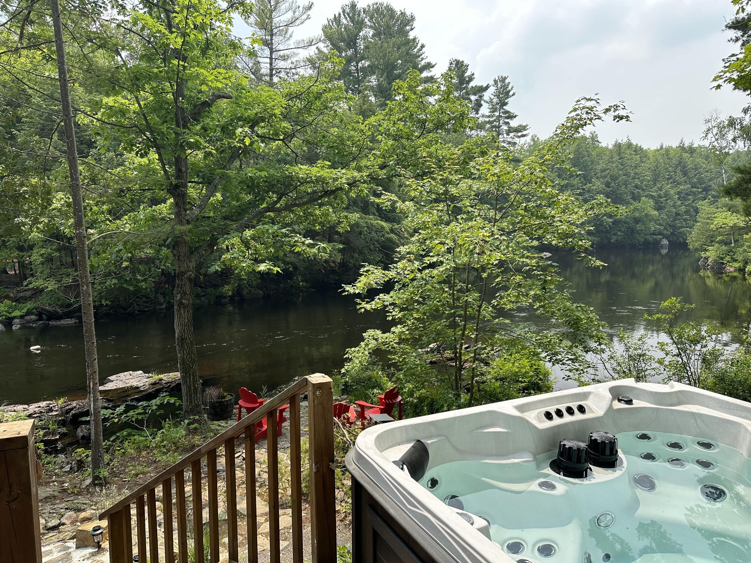 Pet Friendly Riverside Cozy Cabin in Woods with Hot Tub