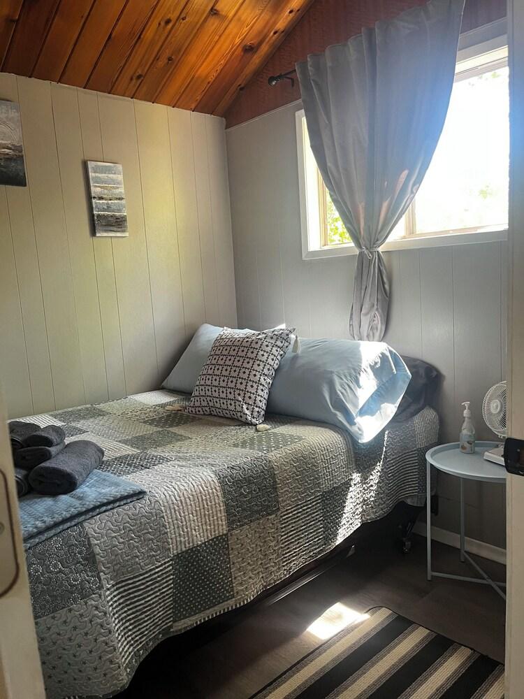 Pet Friendly Cozy Grand Beach Cottage in the Park