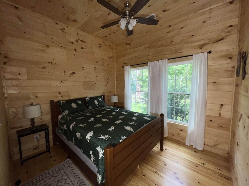 Pet Friendly Riverfront Log Cabin with Deck Overlooking Water