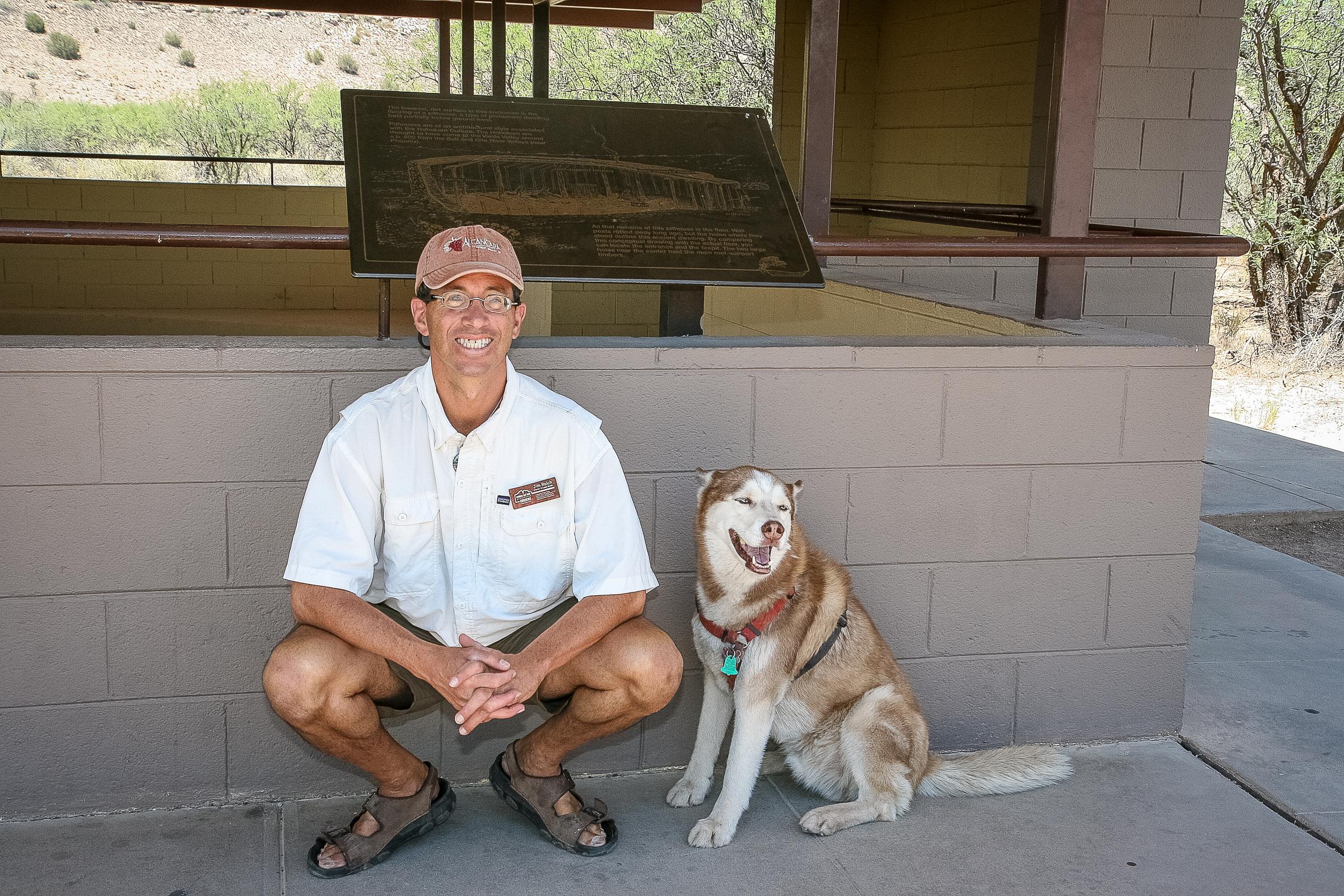 Man And His Dog Await A Tour