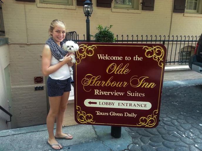 A dog and her human at the Olde Harbour Inn Olde Harbour Inn is one of the most pet-friendly hotels in the South.