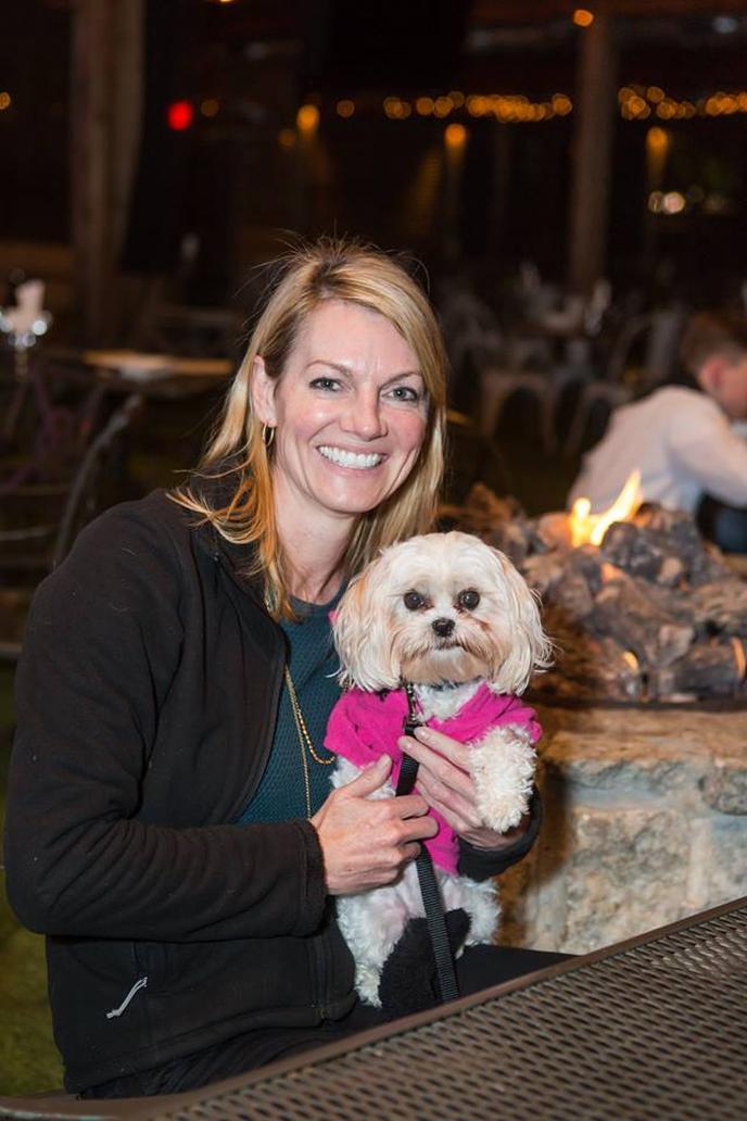 A puppy and her human enjoy the pet-friendly Park Tavern in Atlanta. Park Tavern is a pet-friendly restaurant with a fire pit in Atlanta.