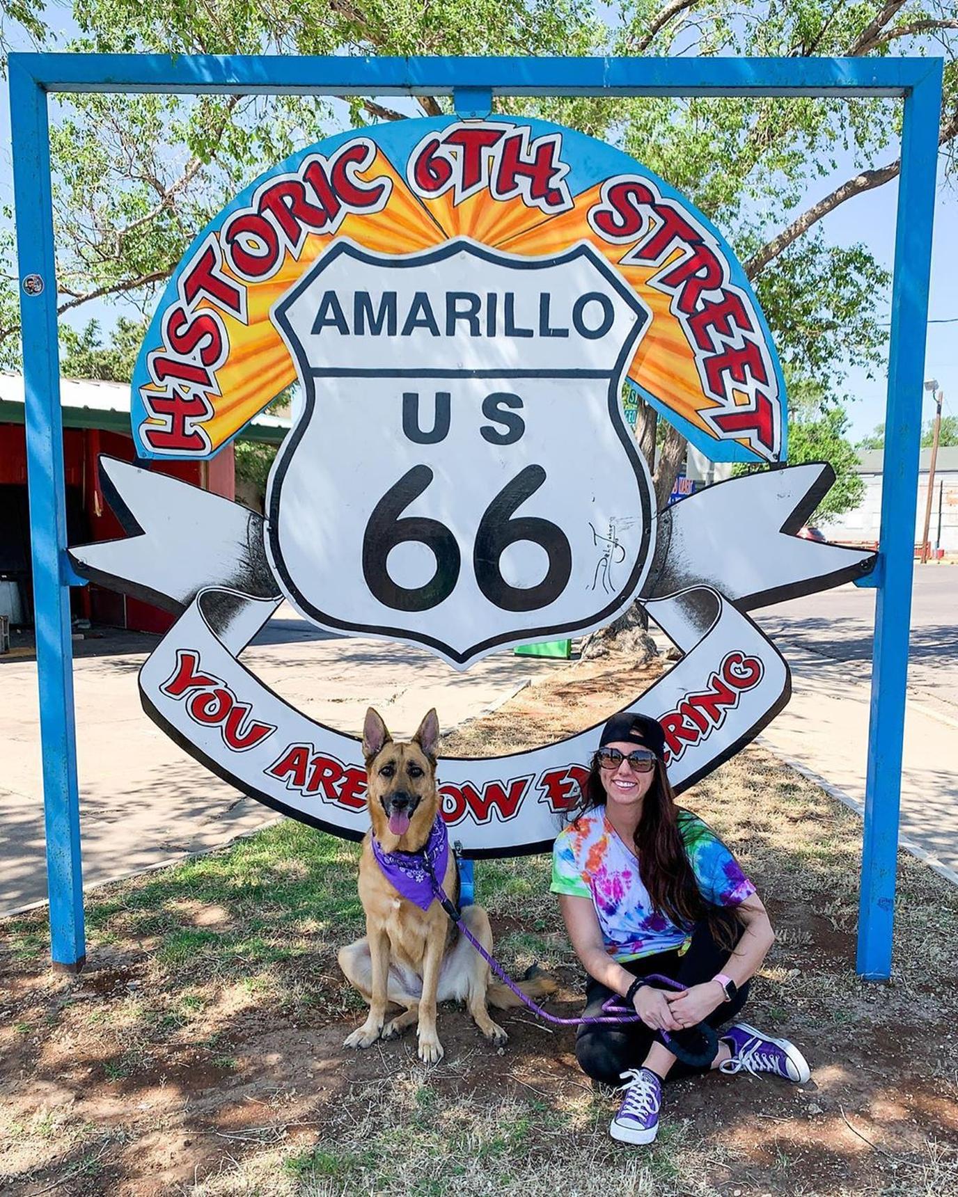 Woman and Dog Stan in Front of the Historic Route 66 Sign in Pet-Friendly Amarillo.