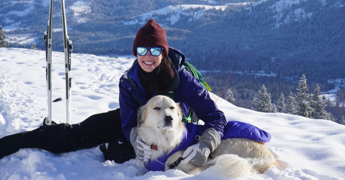 A dog and his mom go skiing in Tahoe City Winter Sports Park.
