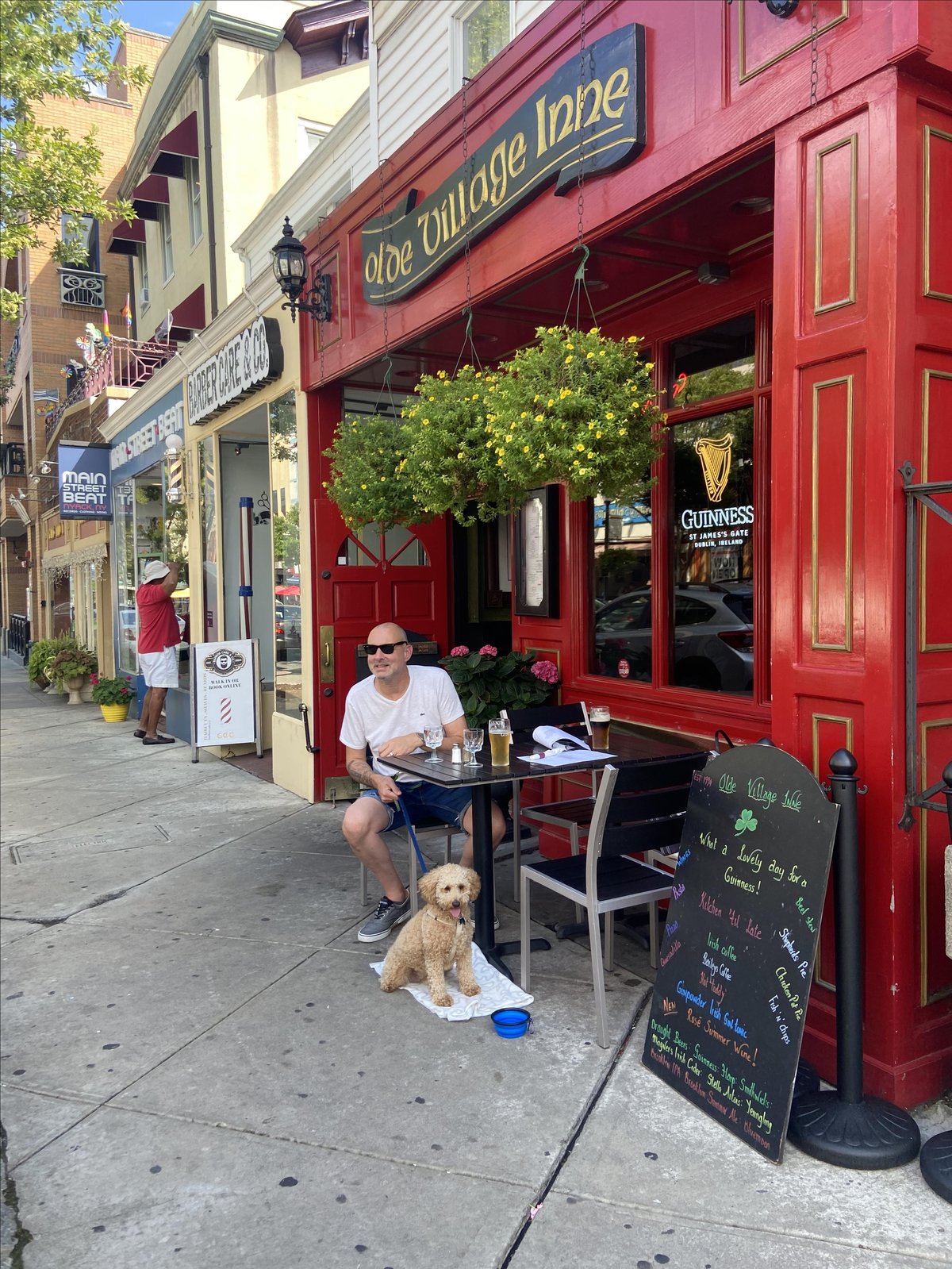 A man dines with his dog on the pet-friendly patio at Olde Village Inne in Nyack, NY.