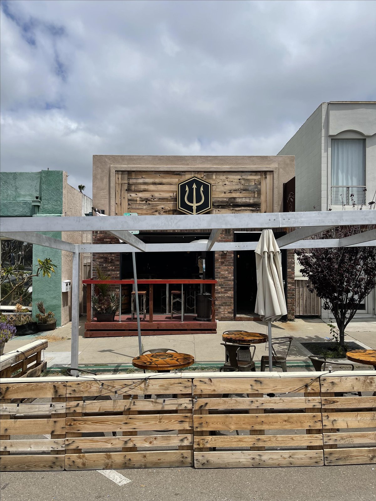 Photo of the exterior of Poseidon Project, a dog-friendly pizza restaurant in San Diego, CA.