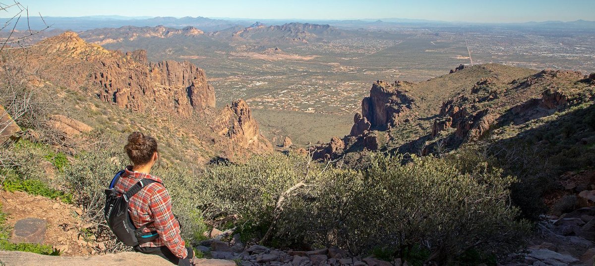 A woman hiking at Lost Dutchman State Park, a dog-friendly state park in Apache Junction, AZ. Photo by Arizona State Parks Lost Dutchman State Park Division.