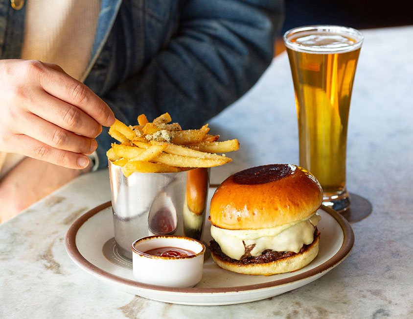 A cheeseburger, fries and a beer from Hunter, NY's dog-friendly Prospect restaurant. Photo by Scribner's Catskill Lodge.