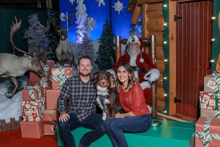 Dog and Santa Claus pose for photo in Bass Pro Shops 2020.